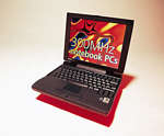 A black Dell Latitude laptop, open, its screen showing a red “300MHz Notebook PCs” promo graphic
